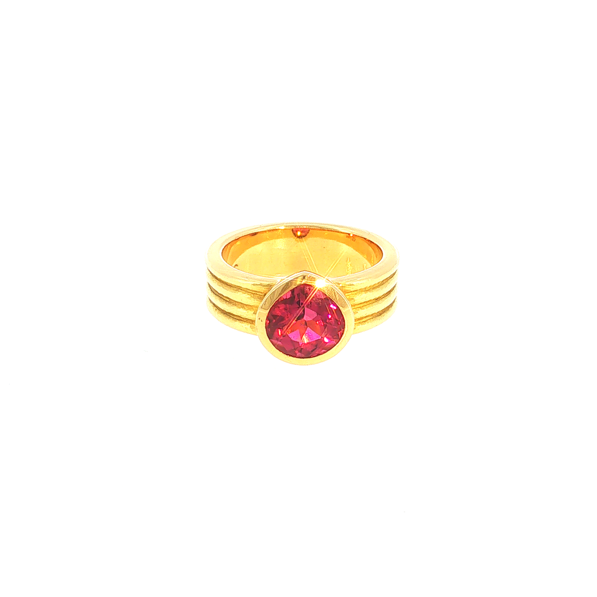 Solitaire Ring with Reddish-Pink Tourmaline in Ribbed Yellow Gold