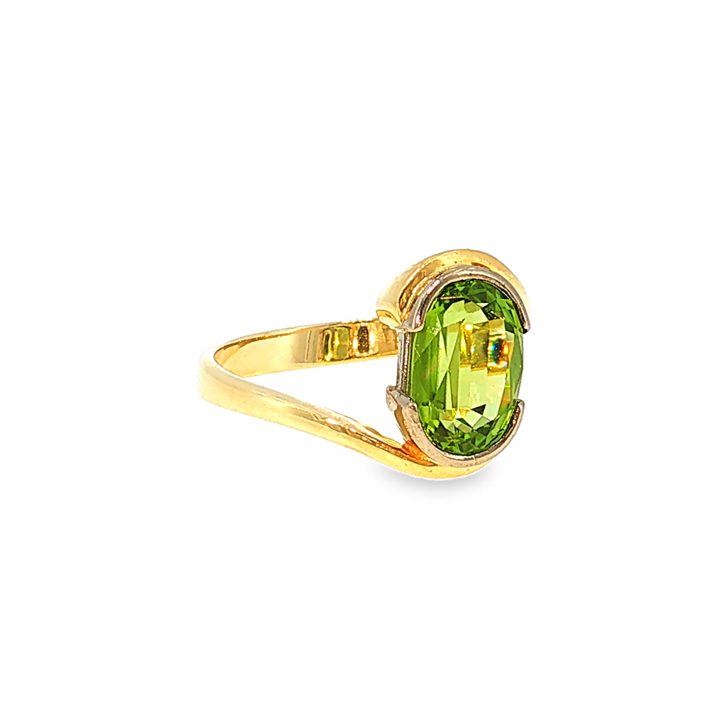 18kt Gelbgold Solitärring mit ca. 4ct Peridot im Bypass-Design